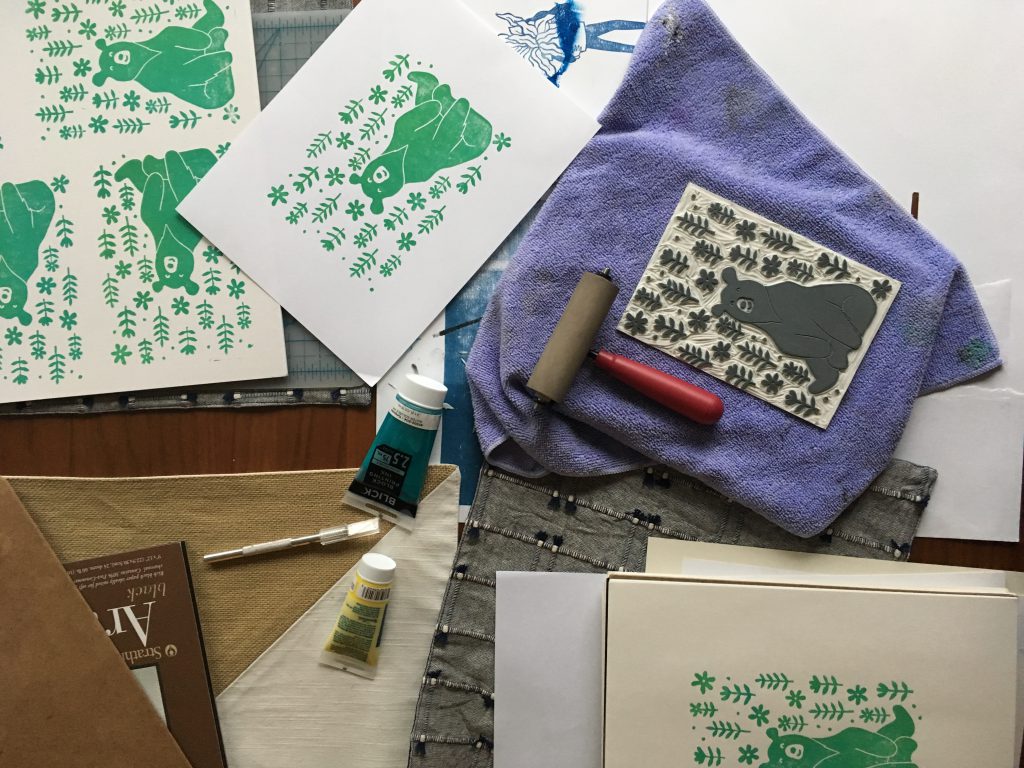 An assembly of linocut tools and art