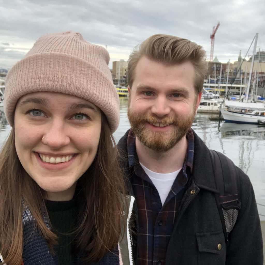 Kaila and Ian take a selfie in front of the Victoria, BC, marina