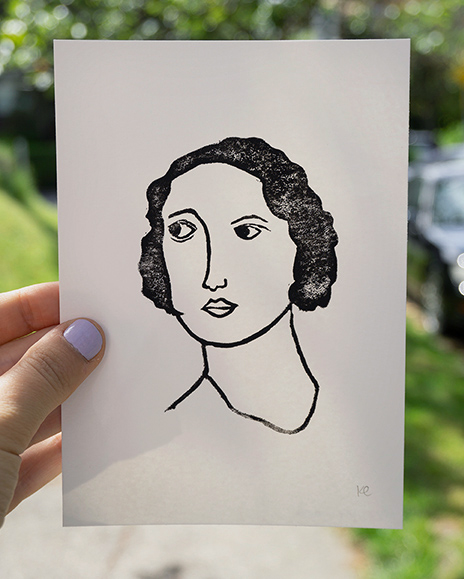 A linocut print of a woman's face