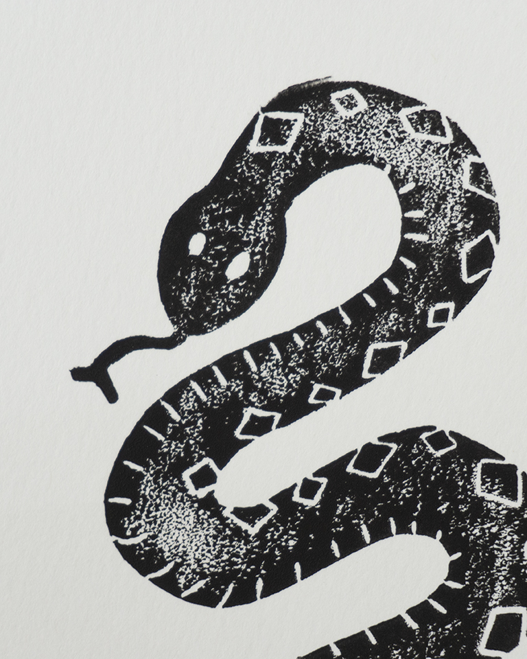 A linocut print of a snake